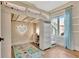 Stylish bedroom featuring loft bed, built-in desk, ample drawers, and great natural light at 165 2Nd St, Fayetteville, GA 30214