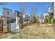 Charming front yard with manicured lawn, iron gate, and mature landscaping at 165 2Nd St, Fayetteville, GA 30214