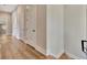 Hallway with hardwood floors and multiple doors at 165 2Nd St, Fayetteville, GA 30214