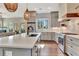 Bright, open kitchen with an island, stainless steel appliances, and modern pendant lighting at 165 2Nd St, Fayetteville, GA 30214
