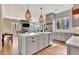 Bright, open kitchen with an island, modern appliances, and seamless living room integration at 165 2Nd St, Fayetteville, GA 30214