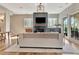Spacious living area with fireplace, TV, hardwood floors, and patio access at 165 2Nd St, Fayetteville, GA 30214