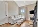 Living room with a comfortable couch and a window at 165 2Nd St, Fayetteville, GA 30214