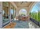 Charming outdoor patio with brick floor, seating area, and landscaped greenery at 165 2Nd St, Fayetteville, GA 30214