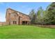 Spacious backyard featuring a well-maintained lawn and a large deck at 245 Astoria Way, Mcdonough, GA 30253