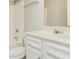Bright bathroom featuring a tub with shower and white vanity at 245 Astoria Way, Mcdonough, GA 30253