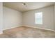 Bedroom featuring a window and neutral walls at 245 Astoria Way, Mcdonough, GA 30253