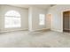 Open bedroom with large window, neutral colors, and closet at 245 Astoria Way, Mcdonough, GA 30253