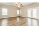 Living room featuring natural light, neutral walls, and doors leading to the outdoors at 245 Astoria Way, Mcdonough, GA 30253