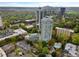 Stunning aerial view of high-rise residential building, surrounded by trees and cityscape at 2870 Pharr Court South Nw # 504, Atlanta, GA 30305