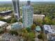 Beautiful aerial view showcases high-rise with pool and tennis court, nestled in lush surroundings at 2870 Pharr Court South Nw # 504, Atlanta, GA 30305