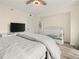 Cozy bedroom featuring a television and a crib, perfect for a young Gathering at 2870 Pharr Court South Nw # 504, Atlanta, GA 30305