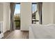 Bright bedroom with stylish curtains and large windows offering city views, creating a modern aesthetic at 2870 Pharr Court South Nw # 504, Atlanta, GA 30305