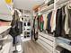 Organized walk-in closet with ample storage for clothes, shoes, and accessories at 2870 Pharr Court South Nw # 504, Atlanta, GA 30305