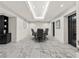 Conference room with marble floors, table with six chairs, black accent doors and an accent wall at 2870 Pharr Court South Nw # 504, Atlanta, GA 30305
