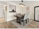 Elegant dining area featuring a modern light fixture and seating for four at 2870 Pharr Court South Nw # 504, Atlanta, GA 30305