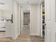 Hallway leading to a bathroom and bedroom with ample closet space for storage at 2870 Pharr Court South Nw # 504, Atlanta, GA 30305