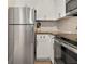 Updated kitchen with stainless steel appliances and white cabinetry at 2870 Pharr Court South Nw # 504, Atlanta, GA 30305