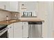 Kitchen featuring granite countertops, stainless steel appliances, and a view into the living room at 2870 Pharr Court South Nw # 504, Atlanta, GA 30305