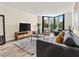Cozy living room with large windows offering ample natural light at 2870 Pharr Court South Nw # 504, Atlanta, GA 30305