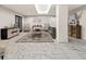 Comfortable lobby with sleek gray sofa, stylish decor, hardwood cabinet, neutral color palette, and marble floor at 2870 Pharr Court South Nw # 504, Atlanta, GA 30305