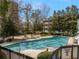 Community swimming pool surrounded by lounge chairs, perfect for relaxation and recreation at 2870 Pharr Court South Nw # 504, Atlanta, GA 30305