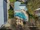 Aerial view of the community pool, sundeck, and lounge seating surrounded by mature trees and landscaping at 2870 Pharr Court South Nw # 504, Atlanta, GA 30305