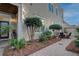 Serene backyard featuring a patio with dining set, manicured landscaping, and a view of the home's exterior at 4124 Hunt St, Covington, GA 30014