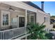 Relaxing outdoor balcony with comfortable seating, ceiling fans, and a view of the surrounding neighborhood at 4124 Hunt St, Covington, GA 30014