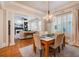 Open concept dining room with hardwood floors and views of the living room at 4124 Hunt St, Covington, GA 30014