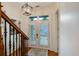 Bright entryway with double doors, transom window, and decorative light fixture at 4124 Hunt St, Covington, GA 30014
