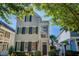 Charming two-story home with symmetrical design, blue shutters, covered porch, and well-manicured landscaping at 4124 Hunt St, Covington, GA 30014