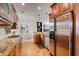 Gourmet kitchen with granite countertops, stainless steel appliances, and custom cabinets at 4124 Hunt St, Covington, GA 30014