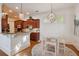 Eat-in kitchen with bar seating, modern lighting, and stainless appliances at 4124 Hunt St, Covington, GA 30014