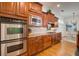 Bright kitchen boasts stainless steel appliances, double oven, and spacious layout with dining area at 4124 Hunt St, Covington, GA 30014