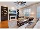 Cozy living room featuring a fireplace, built-in bookshelves, and natural light at 4124 Hunt St, Covington, GA 30014