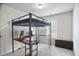 Bedroom with carpet floors, neutral paint, a window and a loft bed with workspace underneath at 4133 Shoals Ln, Union City, GA 30291