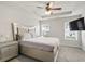 Primary bedroom featuring carpet floors, natural light and a television mounted on the wall at 4133 Shoals Ln, Union City, GA 30291