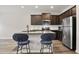 Modern kitchen featuring stainless steel appliances and breakfast bar seating at 4133 Shoals Ln, Union City, GA 30291