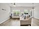 Bright living room featuring hardwood floors, lots of natural light, and modern furnishings at 4133 Shoals Ln, Union City, GA 30291