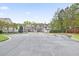 Exterior image showing a street view of townhomes with mature landscaping and a gated entrance at 4133 Shoals Ln, Union City, GA 30291