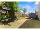 Backyard featuring lush grass, a wooden fence, mature trees and a storage shed at 847 Edgeley Ln, Lawrenceville, GA 30044