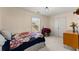 Bedroom with carpeted floors, double door closet, and window at 847 Edgeley Ln, Lawrenceville, GA 30044