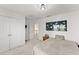 Bright bedroom featuring neutral walls, carpet floors, and a closet for storage space at 847 Edgeley Ln, Lawrenceville, GA 30044