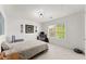 Bright bedroom featuring neutral walls, carpet floors, and a large window letting in natural light at 847 Edgeley Ln, Lawrenceville, GA 30044