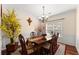 Elegant dining room featuring crown molding, wainscotting, and a decorative chandelier at 847 Edgeley Ln, Lawrenceville, GA 30044