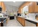 Bright kitchen featuring light cabinets, stainless steel appliances, and adjacent dining area at 847 Edgeley Ln, Lawrenceville, GA 30044