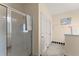 Main bathroom with glass shower, tile flooring, and white tub at 847 Edgeley Ln, Lawrenceville, GA 30044