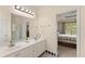 Main bathroom with dual sinks, walk-in shower, and tile floor at 847 Edgeley Ln, Lawrenceville, GA 30044