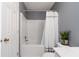 Bathroom with a shower-tub combination and white shower curtain at 261 Silver Ridge Dr, Dallas, GA 30157
